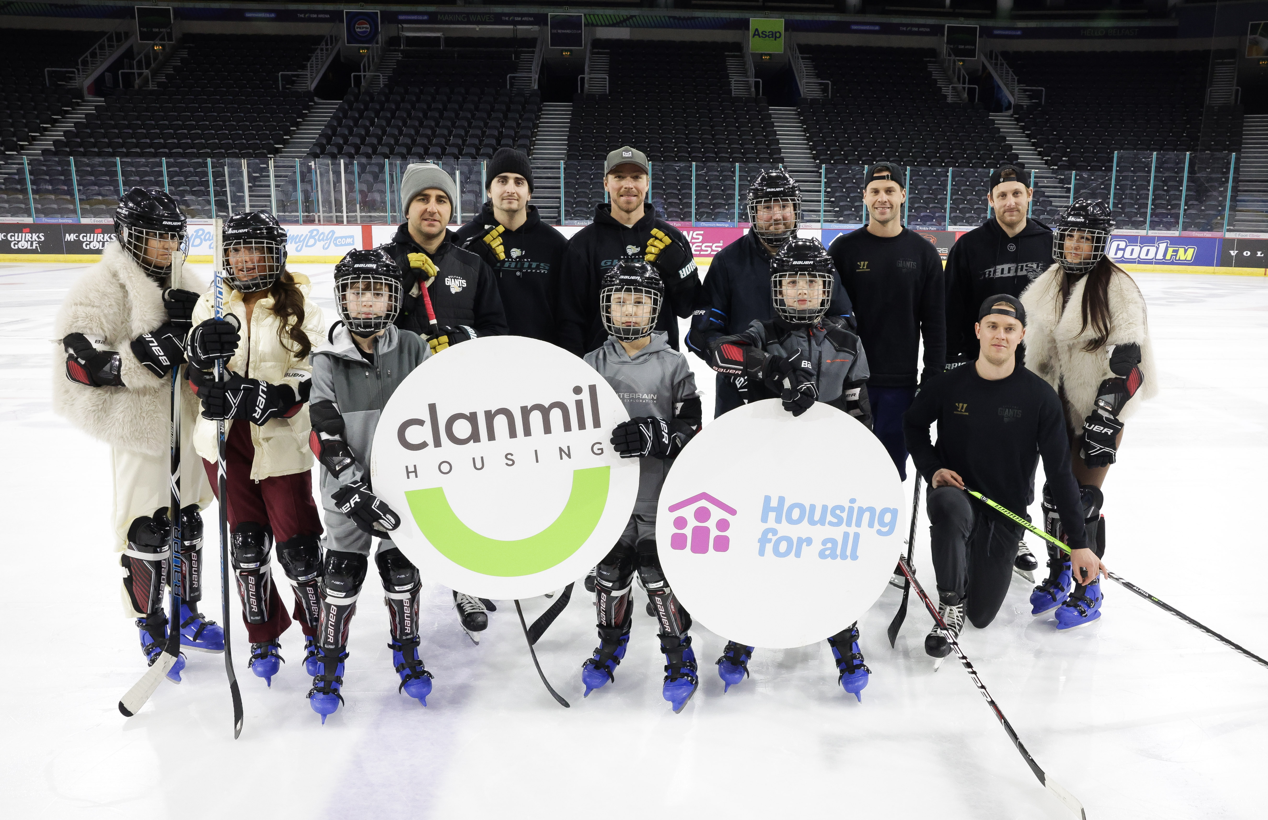 Line Change, Belfast Giants and Participants, holding Clanmil and Housing for All logos