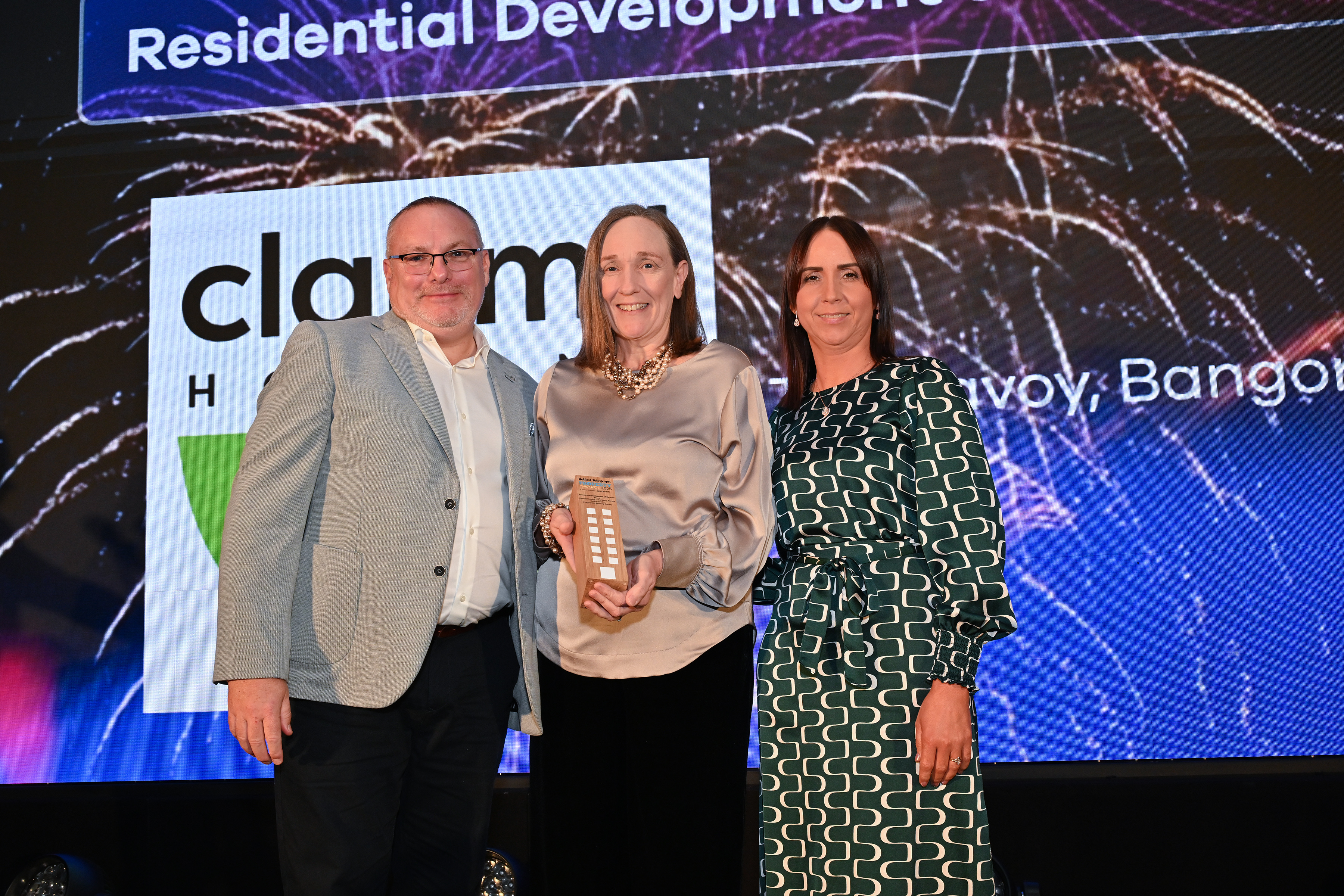 Jan Sloan and Denise Doherty of Clanmil Housing accept the award for Residential Development Of The Year from Gary Stanton of Progressive Building Society 