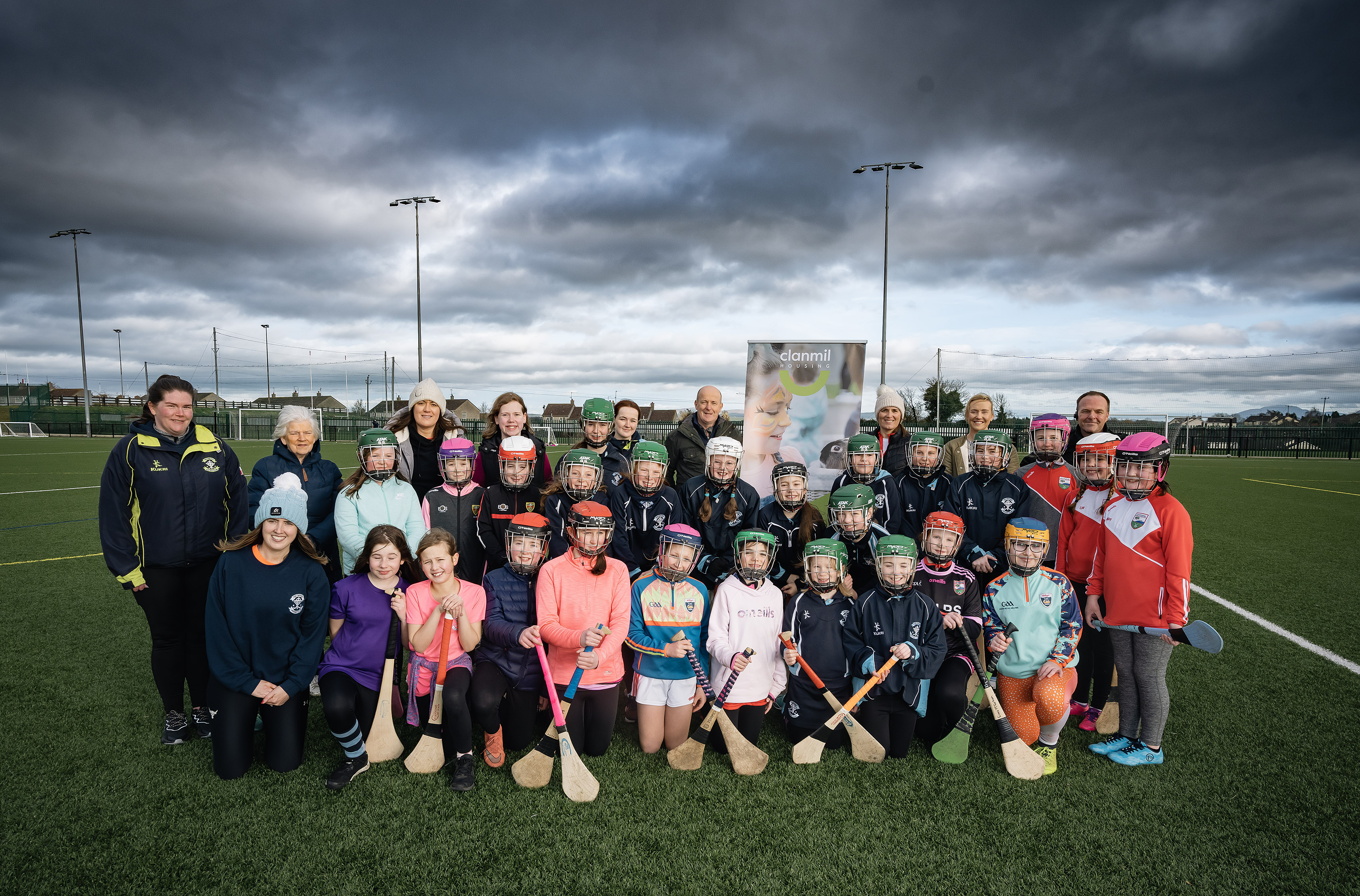 Girls and coaches taking part in Stick With Diversity