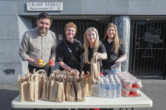 Staff from Clanmil with Paul Doherty outside the Curzon apartments 
