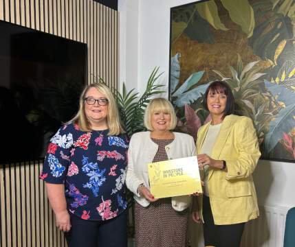 Karen Gilmore, Carol McTaggart and Stephanie McCutcheon with Clanmil's gold Investors in People plaque